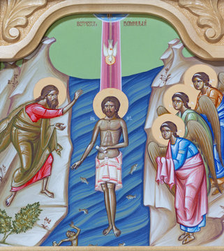 REGGIO EMILIA, ITALY - APRIL 12, 2018: The icon of Baptism of Jesus on the iconostas in church Chiesa di San Giorgio in Reggio Emilia from 20 cent.