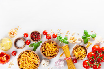 ingredients for italian cousine flat lay, pasta spaghetti penne fusilli tomato oil vegetables