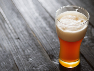Ale beer on a black wooden table