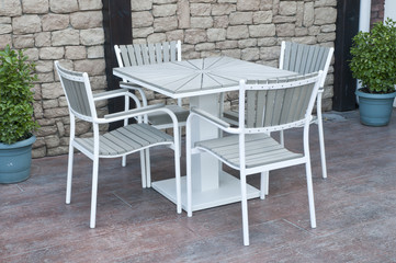 metal and gray wood outdoor patio furniture for dining 
