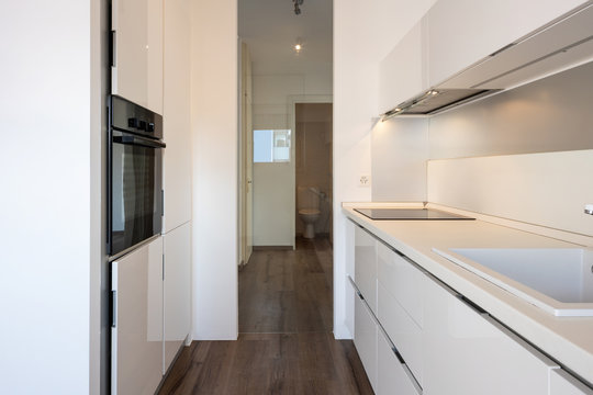 Modern white kitchen detail in apartment