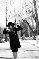 Black and white photo of a young girl on a walk