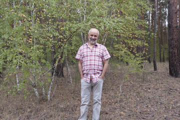 A man of mature age in the forest