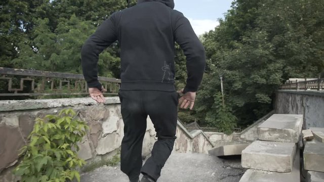 The street gangster running to the man in park
