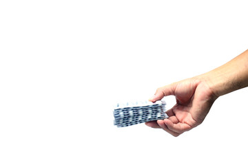 adult hand holding aluminium foil packaging of medicine on white background isolated