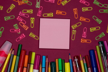 Sticky note, pencils, paper clips on colorful background, blank copy space