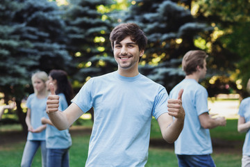 Meeting of young volunteers team in park