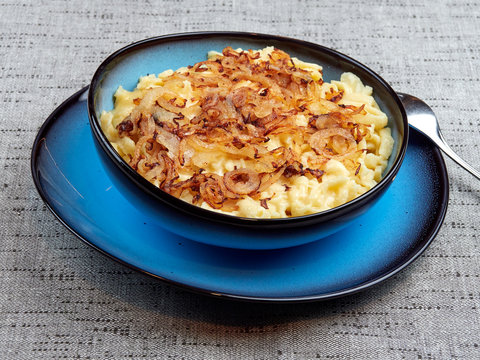 Traditional Swabian "Käsespätzle" - a dish of egg and flour noodles with grated cheese and fried onions. Also spelled kaesespaetzle