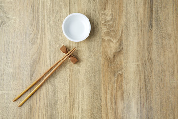 Chopsticks and white bowl