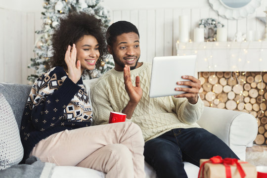 African-american couple chatting online on tablet