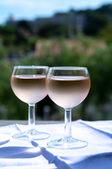 Rose wine of Provence, France, served cold on outdoor terrace in two wine glasses