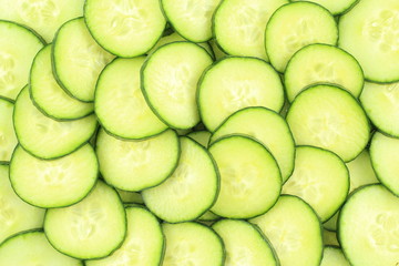 slices of fresh green cucumbers food background texture