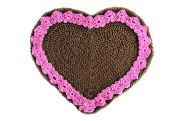 hand crochet Gingerbread heart shape valentines day gift with copy space on white isolated background.