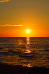 sunset at the baltic sea beach of ustronie morskie, poland