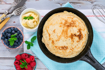 Homemade pancakes on frying pan - top view