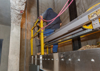 Naklejka premium Lift shaft, during the construction of a multi-apartment high-rise building.