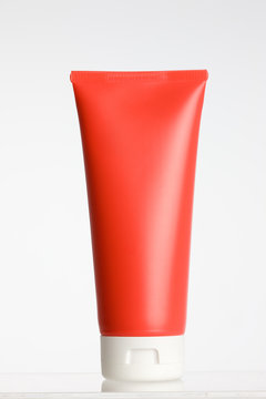 Red tube with white cap