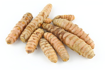 fresh turmeric roots isolated on white background