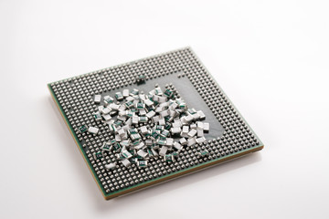 Scattered SMD Chip Resistor / Ceramic Capacitor and a glass bottle on white isolated background