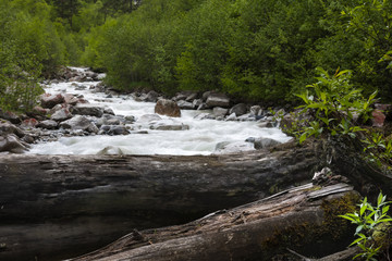Mountain landscape, high mountains and stormy rivers.