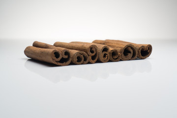Cinnamon and Anise on white background isolated