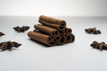 Cinnamon and Anise on white background isolated