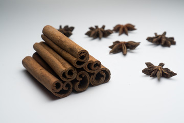 Cinnamon and Anise on white background isolated