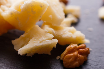 fragrant Parmesan on a slate stone slicing board