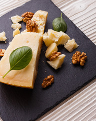 fragrant Parmesan on a slate stone slicing board