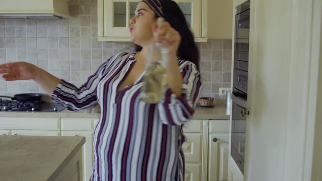 Fat girl opens the refrigerator