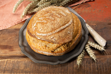 Sourdough homemade round white wheat bread close up