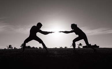 Man and woman tug of war. Argument, couple disagreement concept. 