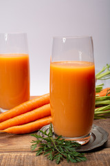 Tasty healthy natural sweet vegetable drink, fresh organic carrot juice ready to drink in glass