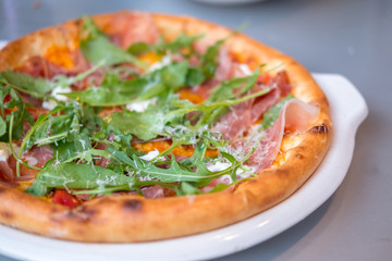 Close up of Parma Ham Pizza on the table.
