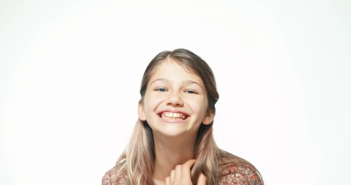 Close up portrait teenager girl laughing isolated on white background