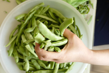 fresh green beans and women in the kitchen,
