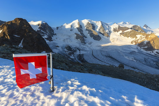 Swiss flag with Palu and Vedret Pers Glacier, Diavolezza Refuge, Bernina Pass, Engadine, Graubunden