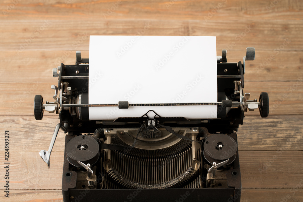 Fototapete top view of retro style typewriter in studio