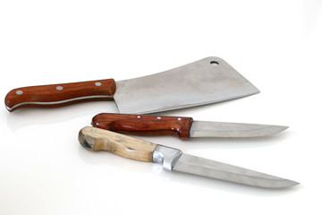 big meat and food knives on white floor


