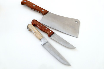big meat and food knives on white floor


