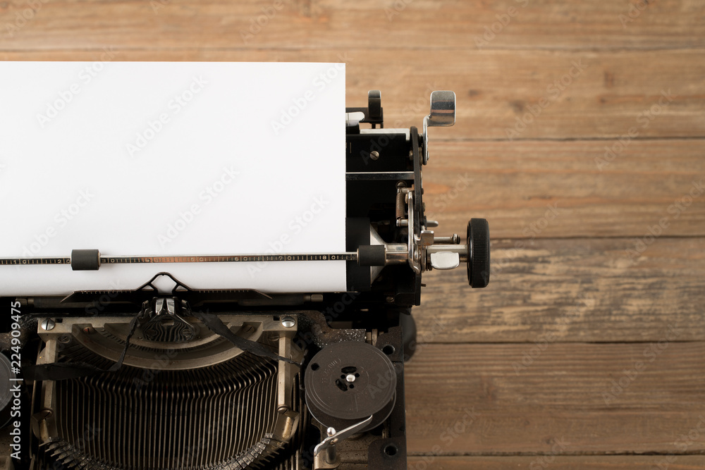 Fototapete top view of retro style typewriter in studio