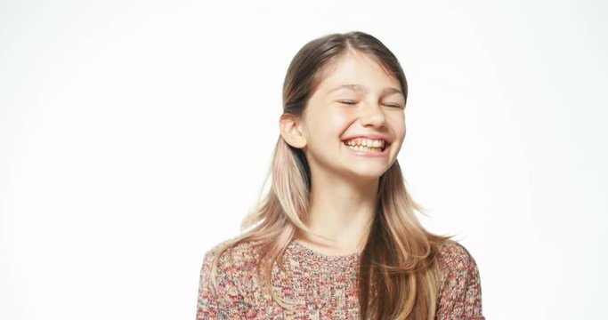 Close up portrait teenager laughing at camera on the white background