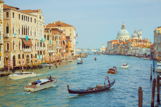 Basilica Santa Maria della Salute, Venice, Italy. Landscape Grand Canal with gondolas and boats.