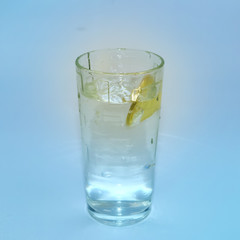 falling coin in a glass of water