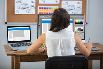 Female Designer Working On Computer