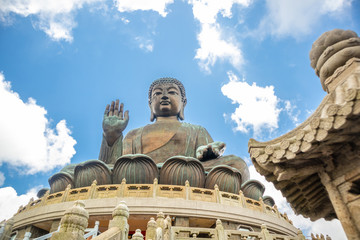 Fototapeta na wymiar Tian Tan Buddha, Big Budda, The enormous Tian Tan Buddha at Po Lin Monastery in Hong Kong. The world's tallest outdoor seated bronze Buddha located in Ngong ping 360.