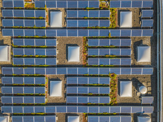 Aerial view of solar cells on rooftop for clean power generatino in Switzerland, Europe
