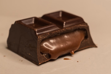 Pieces of chocolate bar filled with chocolate cream