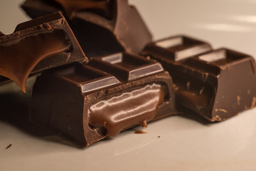 Pieces of chocolate bar filled with chocolate cream