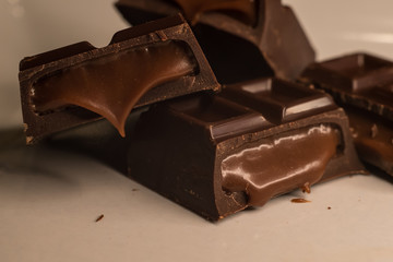 Pieces of chocolate bar filled with chocolate cream